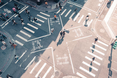 High angle view of people crossing road