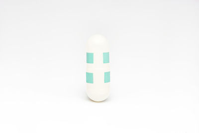 Close-up of fork over white background