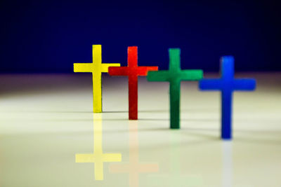 Close-up of toys on table against blue background