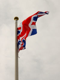 Low angle view of flag against sky