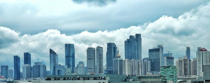Panoramic view of cityscape against sky