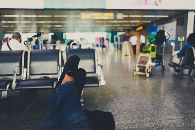 Low section of person resting at airport