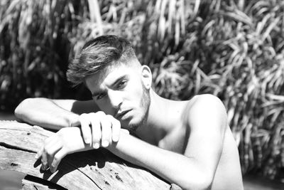 Portrait of young man sitting outdoors