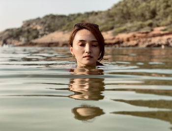 Portrait of man in lake