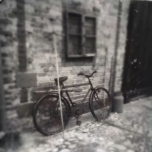 Bicycle parked in front of house