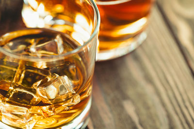 Close-up of beer glasses on table