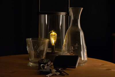 Close-up of wine glasses on table