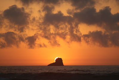 Scenic view of sea against orange sky