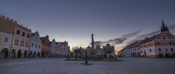 Buildings in city against clear sky