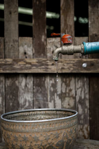 Close-up of faucet against wall