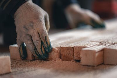 Close-up of man working on wood