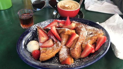 High angle view of fruits in glass on table