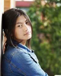 Side view portrait of young woman outdoors