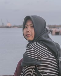 Portrait of mid adult woman standing in water