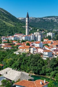 Franciscan church tower rising above mostar, bosnia