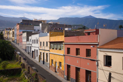 Houses against sky in city