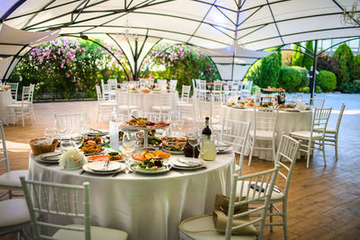 Empty chairs and tables in restaurant