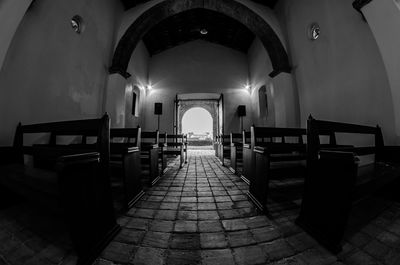Empty chairs in corridor