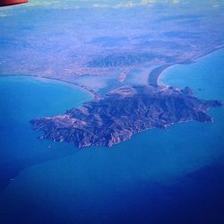 Aerial view of sea against landscape