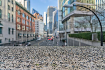 Surface level of street amidst buildings in city