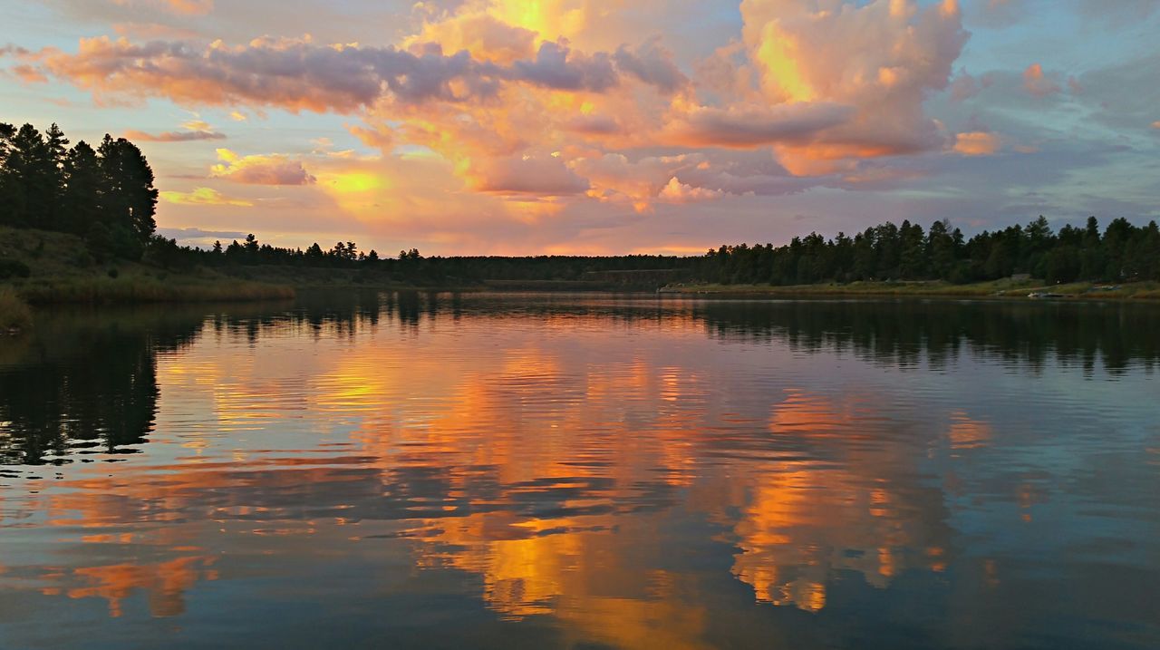 water, sunset, reflection, lake, sky, tranquil scene, scenics, tranquility, waterfront, beauty in nature, cloud - sky, orange color, idyllic, nature, cloud, silhouette, tree, rippled, cloudy, dramatic sky