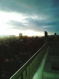 Buildings against cloudy sky