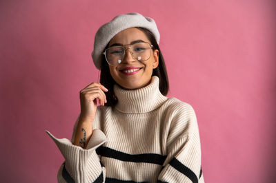 Portrait of young woman wearing hat