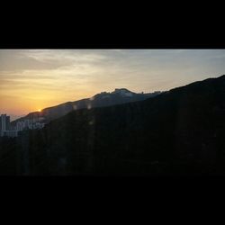 Scenic view of mountains at sunset