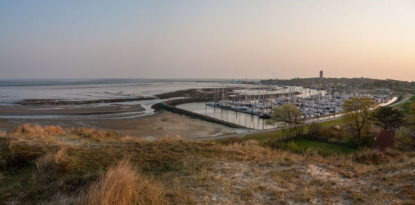 High angle view of beach against sky during sunset