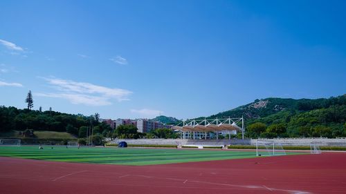 Scenic view of landscape against blue sky