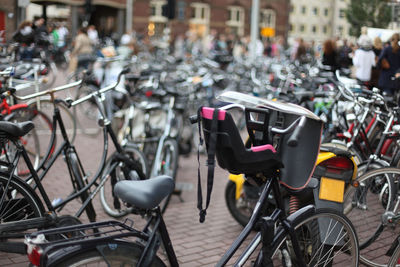 Collection of bicycles parked in city street