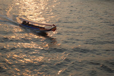 High angle view of boat sailing in sea