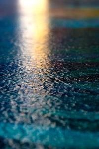 Close-up of sea against sky at sunset