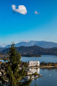 Scenic view of bay against blue sky