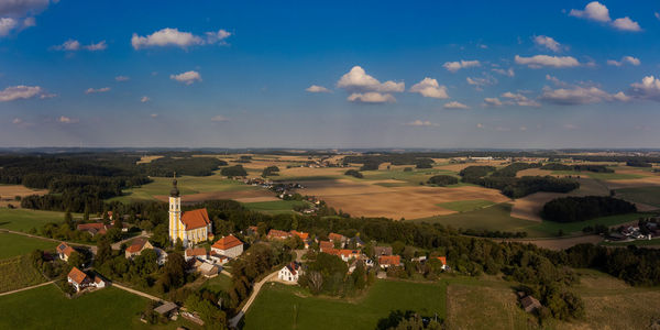 High angle view of houses and buildings against sky