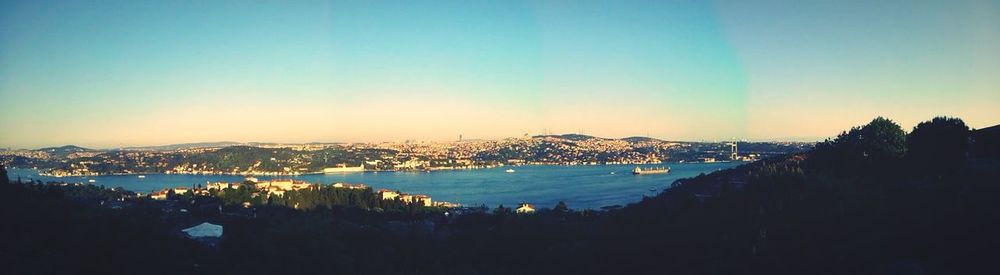 View of cityscape against blue sky