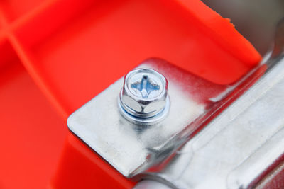 High angle view of red metal on table