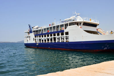 Ship moored on sea against sky