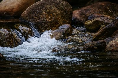 Close-up of water flowing through rocks