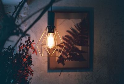 Illuminated pendant light hanging at home