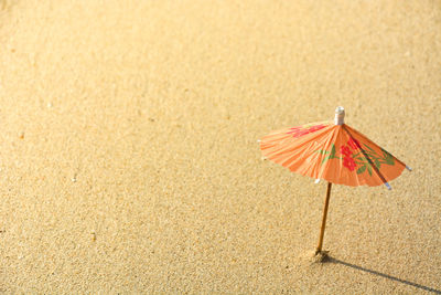 Close-up of umbrella on beach