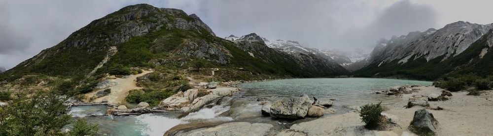 Panoramic view of lake and mountains against sky