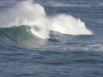 Sea waves splashing on shore