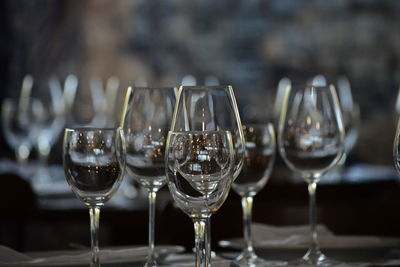 Close-up of wine glasses on table