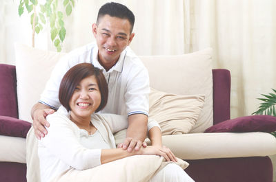 Portrait of smiling couple at home