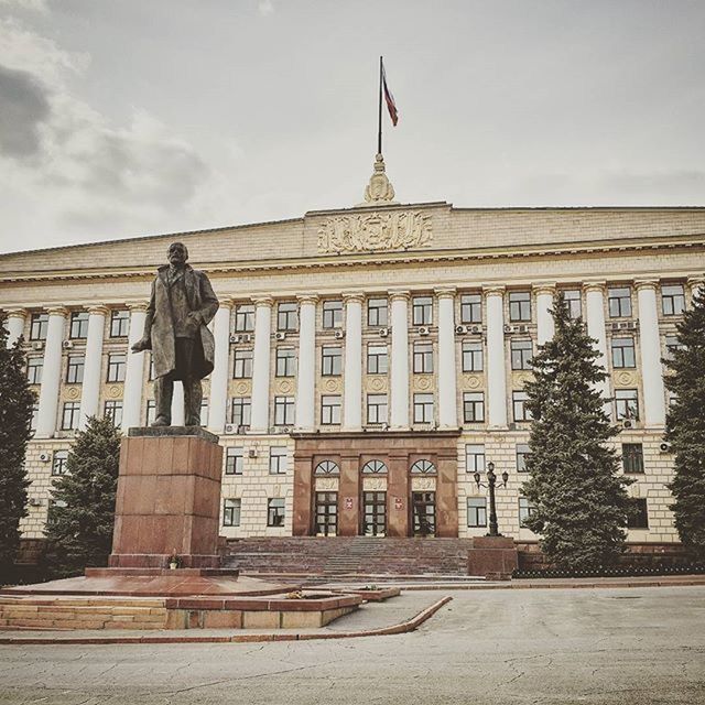 building exterior, architecture, built structure, statue, sky, sculpture, human representation, art and craft, men, art, day, travel destinations, full length, city, lifestyles, creativity, outdoors