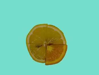 Close-up of lemon slice against white background