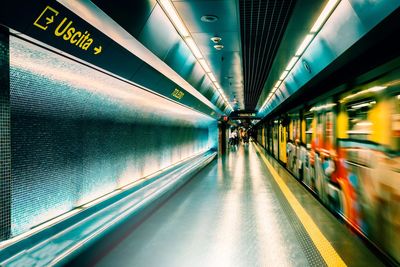 Blurred image of subway train at station