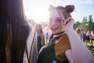 Portrait of smiling young woman at music festival