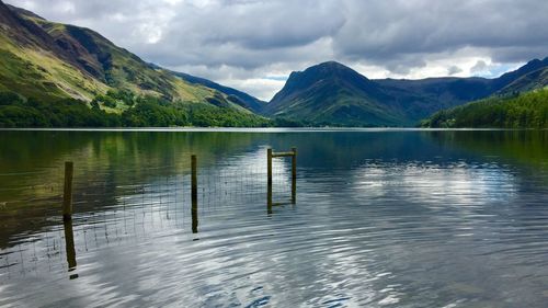 Scenic view of lake and mountains against sky